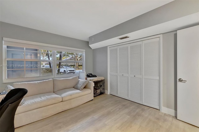 living room with light hardwood / wood-style flooring