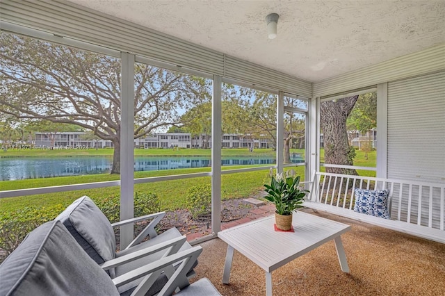 sunroom with a water view and a healthy amount of sunlight