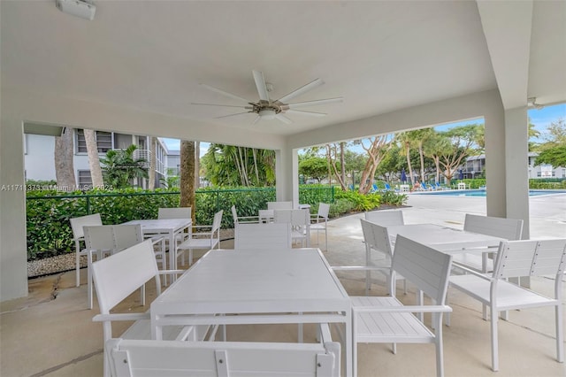 view of patio featuring ceiling fan and a community pool