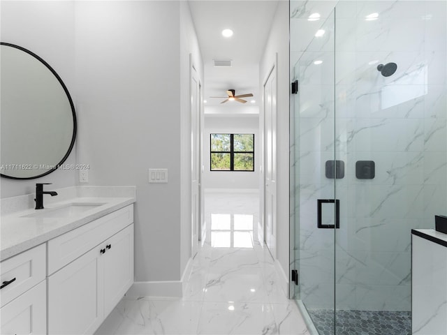 bathroom featuring ceiling fan, an enclosed shower, and vanity