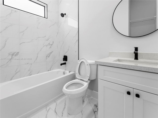 full bathroom with vanity, tiled shower / bath combo, and toilet