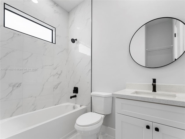 full bathroom featuring tiled shower / bath combo, toilet, and vanity