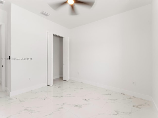 empty room featuring ceiling fan