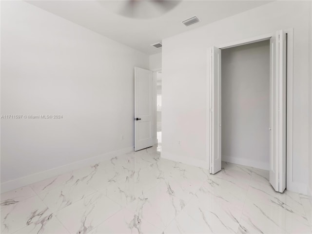 unfurnished bedroom with a closet