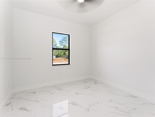 unfurnished room with ceiling fan