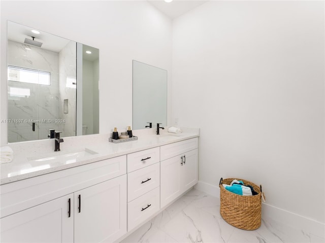 bathroom featuring vanity and a shower with shower door