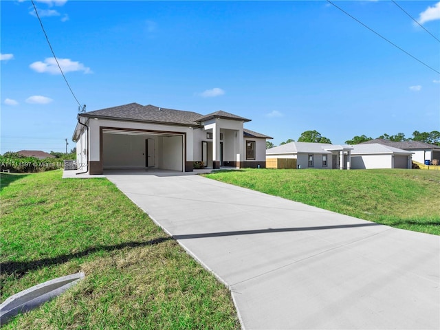 prairie-style home featuring a garage and a front lawn