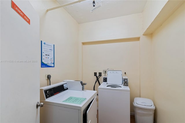 laundry room with washing machine and clothes dryer