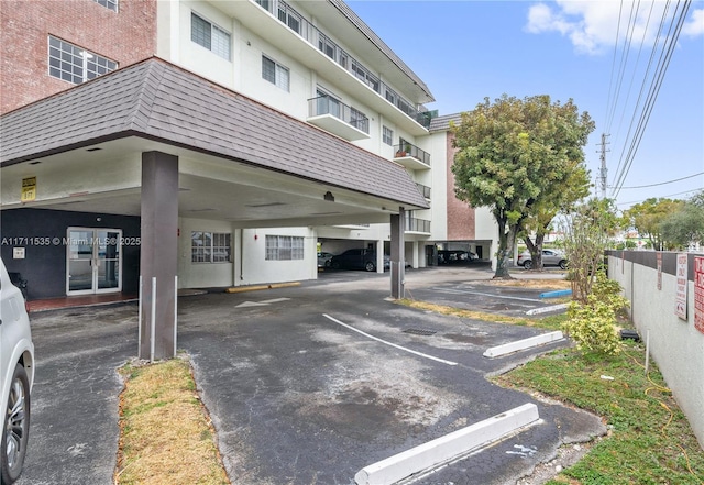 view of parking / parking lot featuring french doors