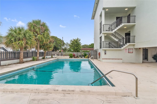 view of swimming pool with a patio area