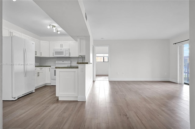 kitchen featuring white appliances, tasteful backsplash, white cabinets, and light wood finished floors