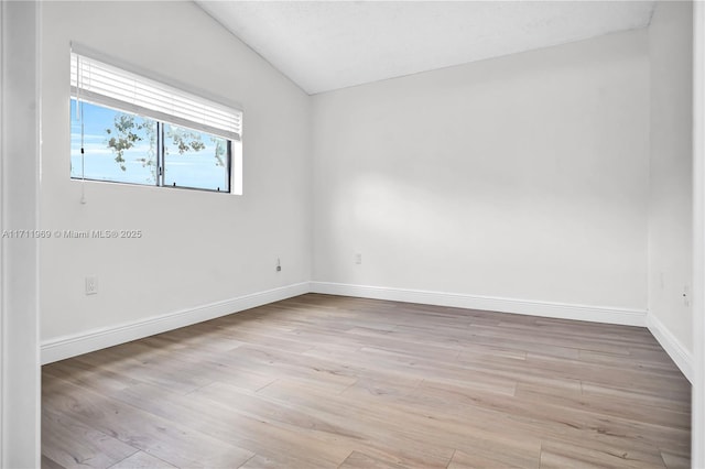 unfurnished room featuring light wood-style flooring and baseboards