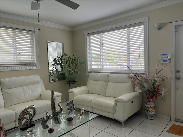 tiled living room with ceiling fan and ornamental molding