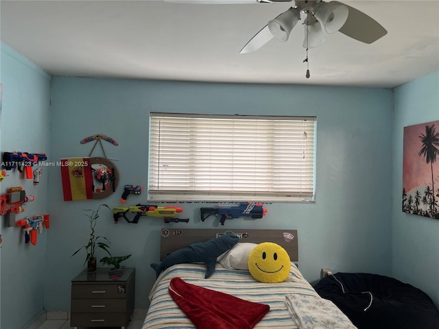 bedroom with ceiling fan and multiple windows