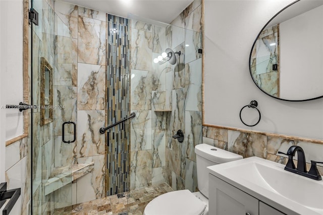 bathroom featuring toilet, an enclosed shower, tile walls, and vanity