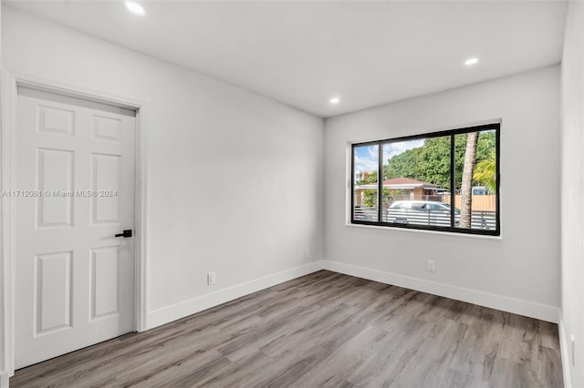 spare room featuring light hardwood / wood-style floors