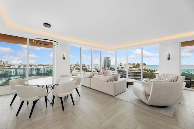 sunroom / solarium featuring a water view