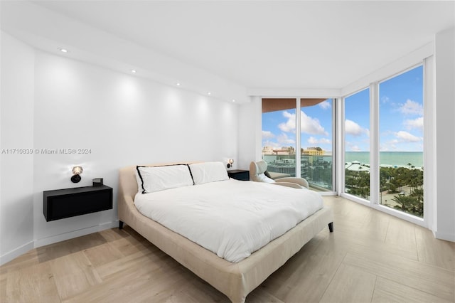 bedroom featuring a water view