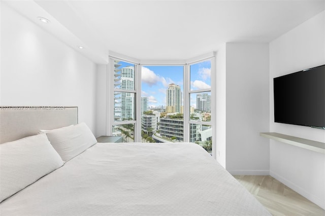 bedroom with floor to ceiling windows