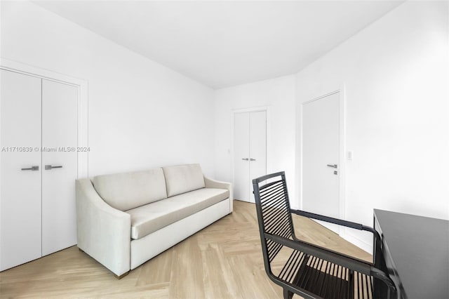 living area featuring light parquet floors