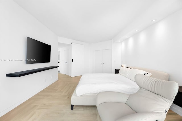 bedroom with light parquet floors