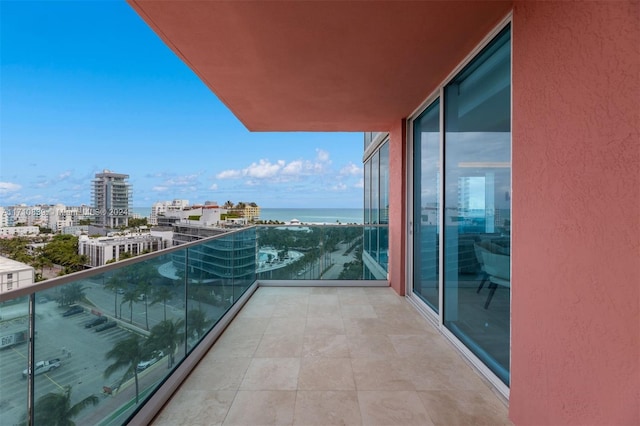 balcony featuring a water view