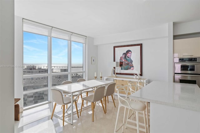 dining area with floor to ceiling windows