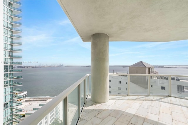 balcony featuring a water view