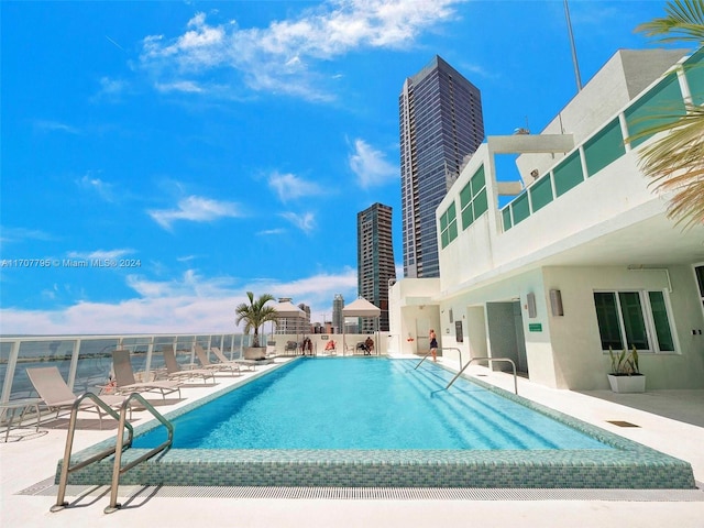 view of swimming pool featuring a patio