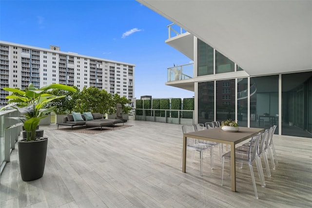 wooden terrace featuring outdoor lounge area