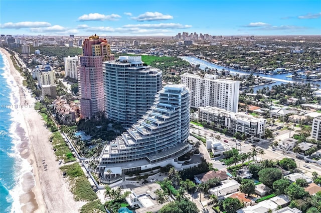 birds eye view of property featuring a water view and a view of the beach