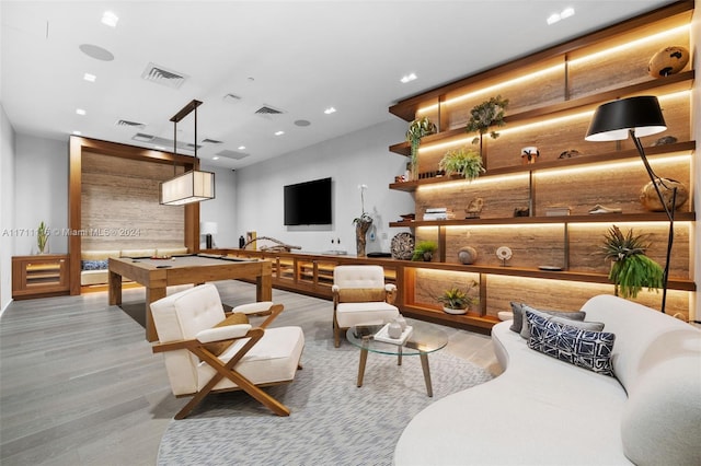 playroom featuring wood walls, billiards, and light hardwood / wood-style flooring