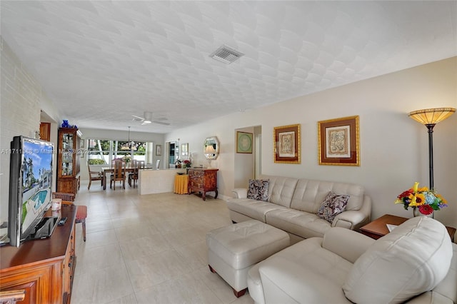 1407 Harding St, Hollywood, FL 33020 - living room featuring visible vents, a ceiling fan, light tile patterned floors, and a textured ceiling