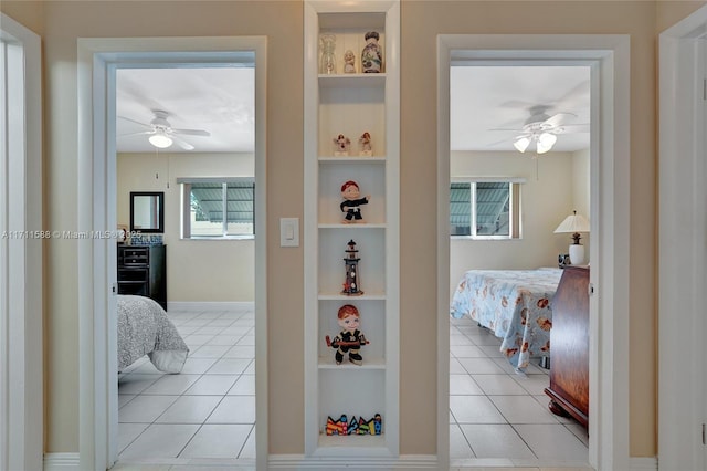 bedroom featuring ceiling fan and light tile patterned floors