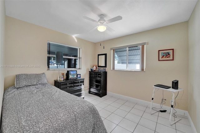 tiled bedroom with ceiling fan