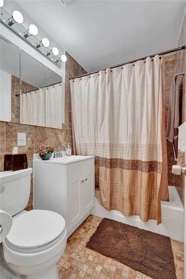 1407 Harding St, Hollywood, FL 33020 - full bath with tile walls, shower / bathtub combination with curtain, toilet, and vanity