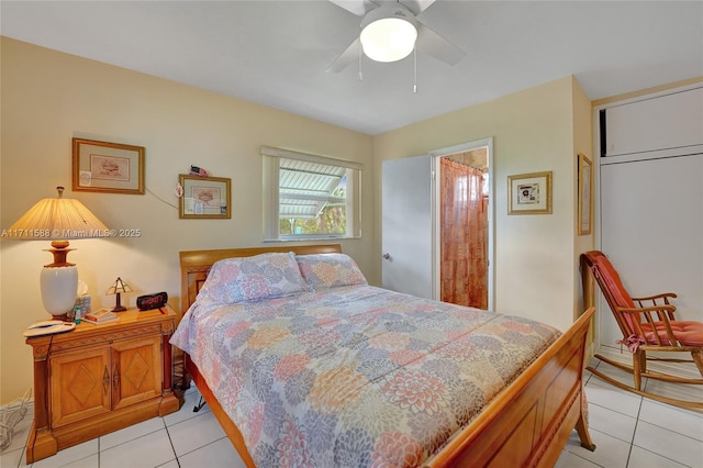 tiled bedroom with a closet and ceiling fan