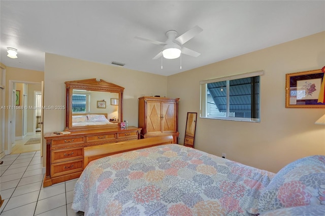 tiled bedroom with ceiling fan