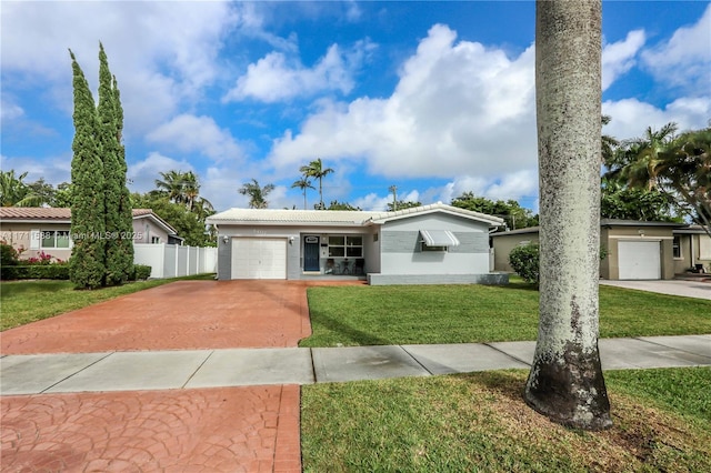 1407 Harding St, Hollywood, FL 33020 - ranch-style house with driveway, fence, an attached garage, a front lawn, and a tiled roof