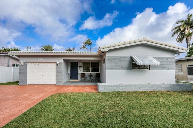 1407 Harding St, Hollywood, FL 33020 - ranch-style home featuring fence, an attached garage, concrete driveway, a front yard, and a tile roof
