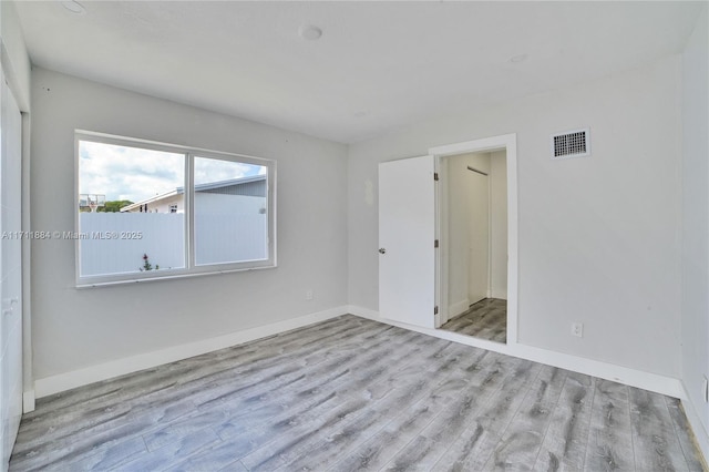 unfurnished bedroom featuring light hardwood / wood-style floors