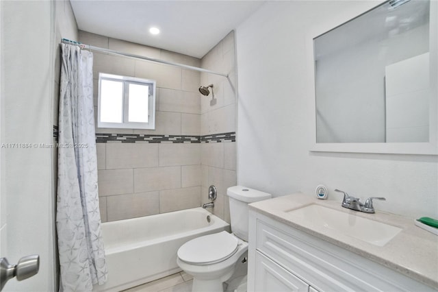 full bathroom featuring shower / bath combination with curtain, vanity, and toilet