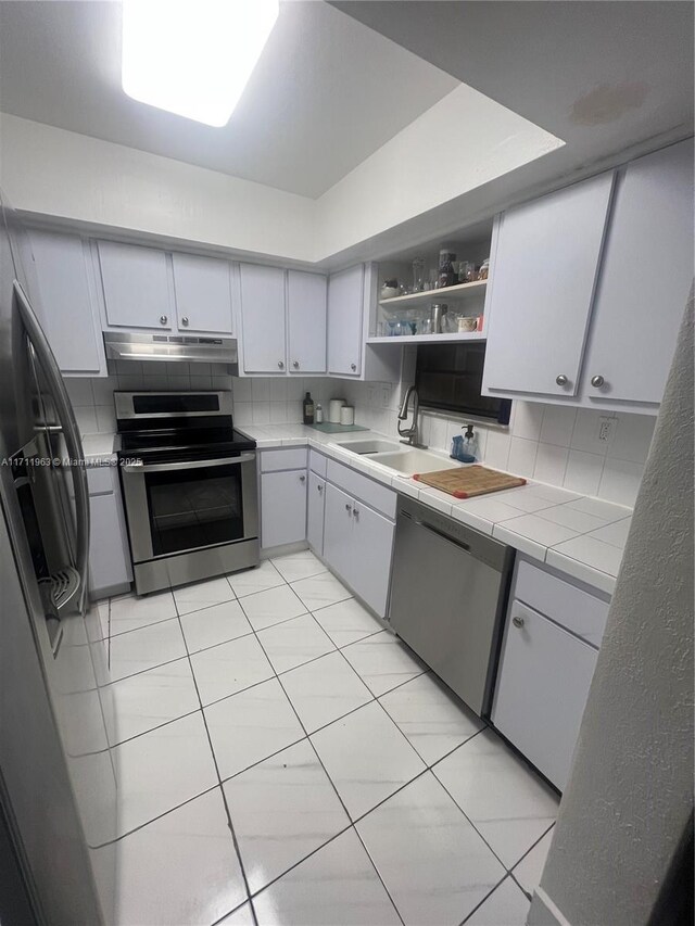 interior space featuring light tile patterned floors and a textured ceiling