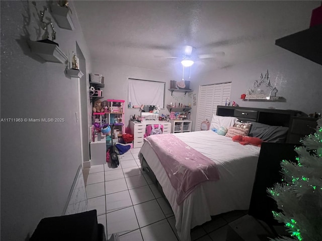 bedroom with light tile patterned floors and ceiling fan