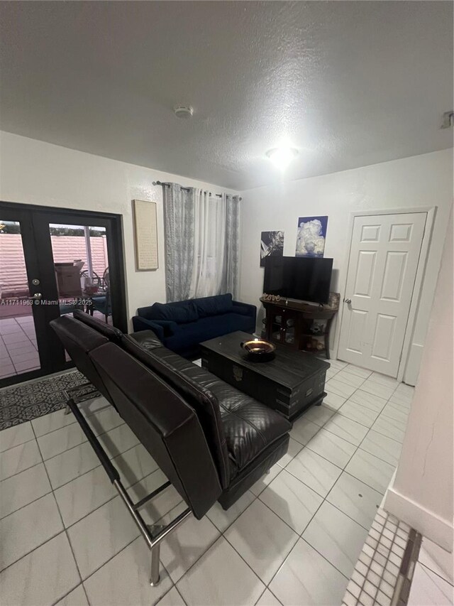 bedroom featuring ceiling fan and light tile patterned floors