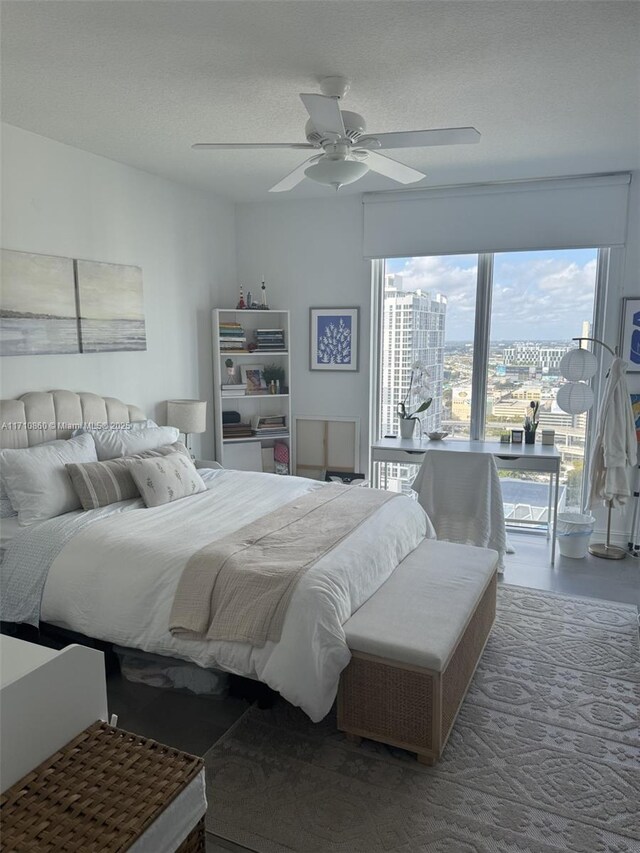 bedroom featuring access to exterior and ceiling fan