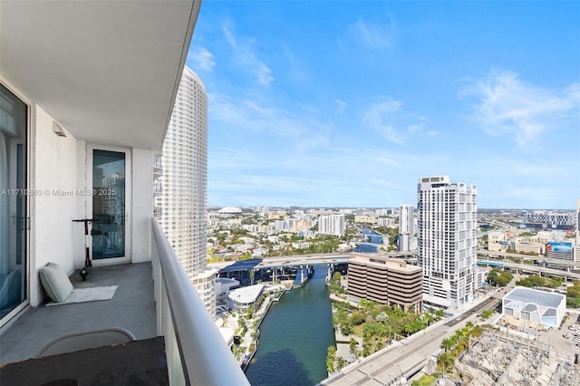 balcony with a water view and a city view