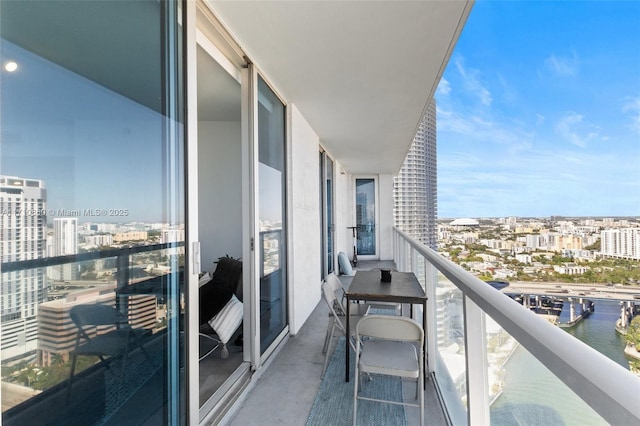 balcony with a city view and a water view