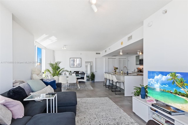 living room featuring visible vents