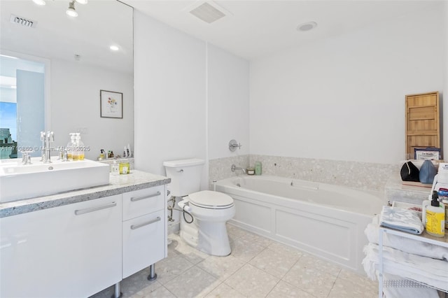 bathroom featuring toilet, visible vents, vanity, and a bath